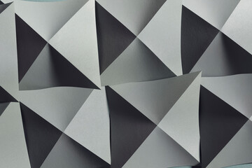 Paper folded in geometric shapes. Abstract