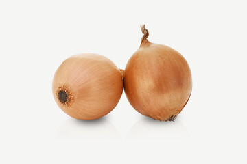 Fototapeta premium Two onions isolated on a white background.