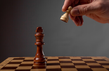 Business strategy concept. Pawn making final last step to make checkmate in chess