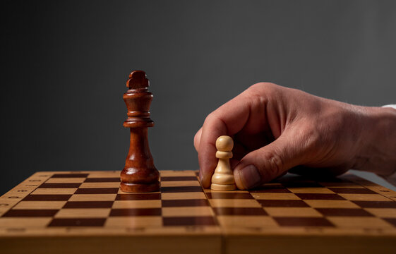 Business strategy concept. Pawn making final last step to make checkmate in chess