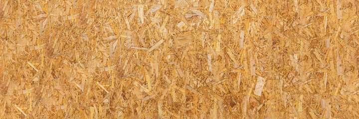 OSB texture. Chipboard sheet. It can be used as a background. Construction concept, fresh renovation, building materials