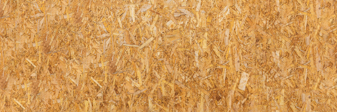 OSB texture. Chipboard sheet. It can be used as a background. Construction concept, fresh renovation, building materials