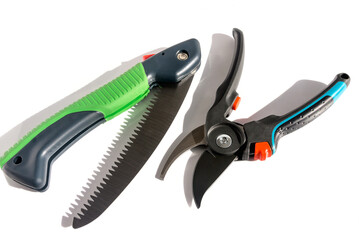 Garden hand tools for pruning shoots from plants, hand saw and garden pruner. 