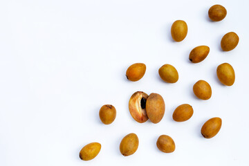 Fresh half sapodilla fruit and whole isolated on white background.