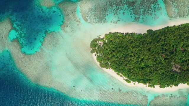 Aerial view of a tropical island in the Indian Ocean. Thinadhoo (Vaavu Atoll), Maldives