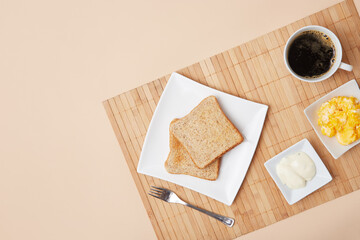 Partial framing of complete fitness breakfast, in zenithal shot on beige background.