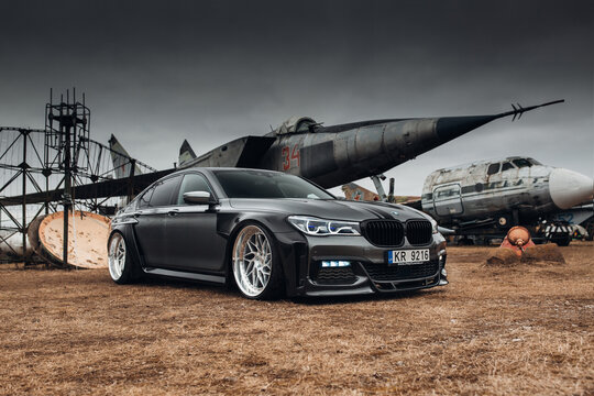 BMW 7 series G11 with carbon widebody kit at the airport museum