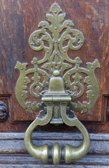 European Vintage old metal wrought iron door knocker. Design detail. Paris.