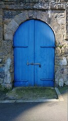 Blue door in a typical fisherman house at Tenby, at Pembrokeshire coast at Wales, Great Britain