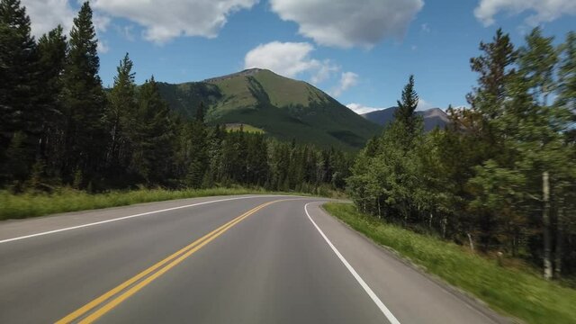 Smooth Drive in Nature Through Kananaskis During Sunny Day Towards Banff