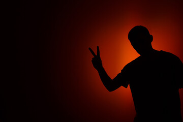 Silhouette of a man in red light.