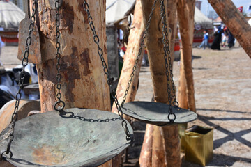 an old scale made of brass and copper. close up of old style antique rusty weight scale