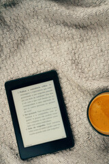 E-book reader and a cup of coffee