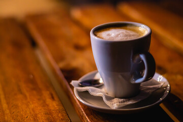 cup of coffee on wooden table