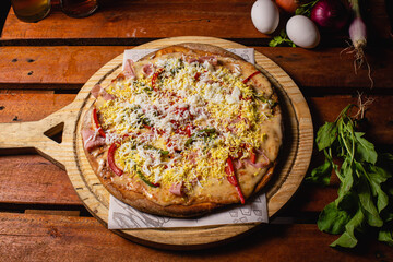 melted mozzarella cheese pizza with dark background