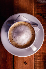 cup of coffee on wooden table