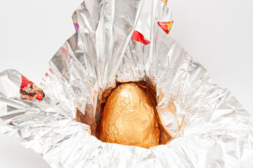 Easter Egg - Unpacking homemade chocolate egg wrapped in aluminum foil