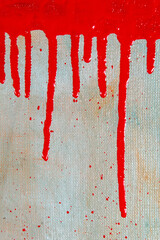 abstract creative background: a red spot with smudges of colored primer when toning the canvas, a temporary object.