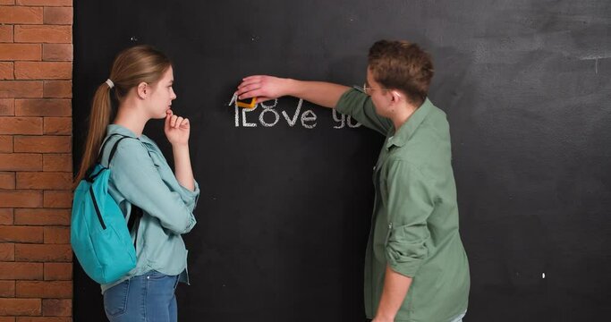 Teenage boy declaring his love to girl at school