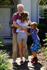 A grandfather is reunited with his granddaughter and grandson after a year apart due to the COVID...