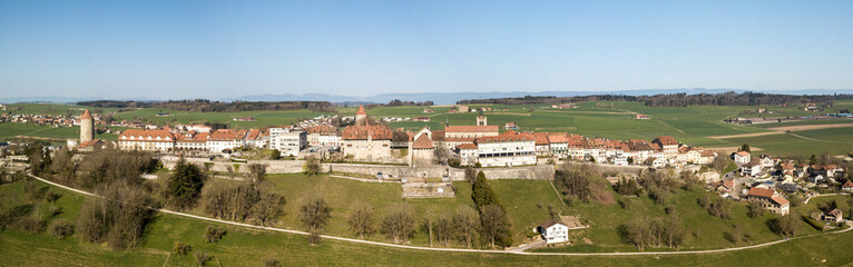 Fototapeta premium Aerial panorama image of old Swiss town Romont, built on a rock prominence, in Canton Freibourg, Switzerland