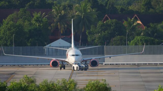 Airplane pushing back at Phuket airport