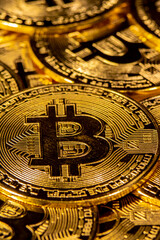Fototapeta na wymiar Close-up of gold Bitcoin coins on yellow background.