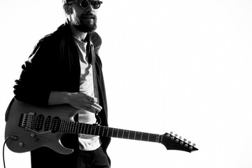 Man wearing sunglasses from guitar music performance lifestyle