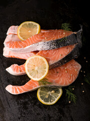 Steak of fresh salmon with aromatic herbs and spices. Top view with copy space