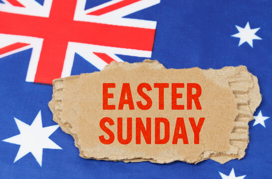 Against the background of the flag of Australia lies cardboard with the inscription - Easter Sunday