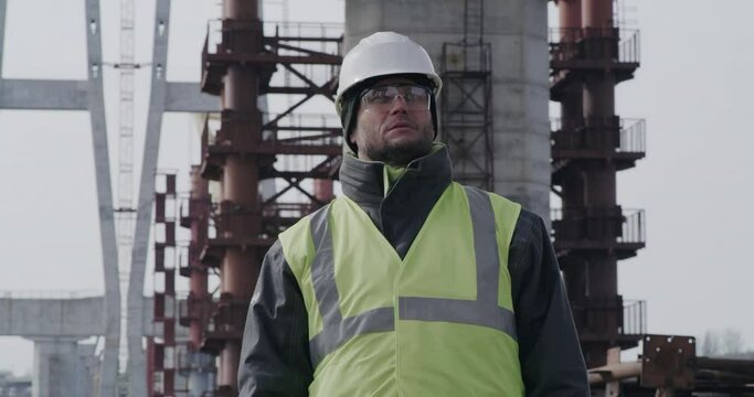 Male contractor on bridge construction site