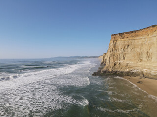 4K Aerial drone photo of cliffside beach in California