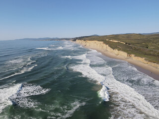 4K Aerial drone photo of coastal cliffs and waves California