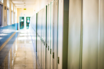 Empty hallway corridor of a high school or college closed during COVID-19 (Coronavirus). Locers...