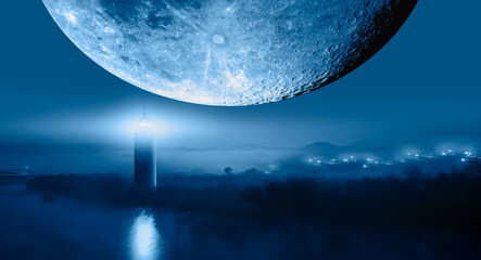 Night sky with super full moon in the clouds, on the foreground lighthouse "Elements of this image furnished by NASA
