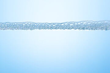 Soap bubbles on the blue background
