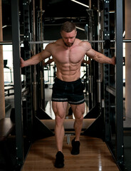 man with weight training in gym equipment sport club
