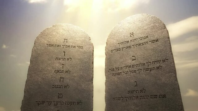 Golden letters of the Ten Commandments on the stone tablets. God told Moses about the Ten Commandments on the stone tablets. Excerpted from the Bible, Exodus 20:1-17, 3D rendered animation.