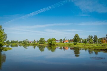 Fototapeta premium Rural river and blue sky
