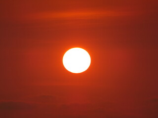 The sun in the orange sky at dusk (Morondava, Madagascar)