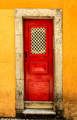 Old and colorful wooden door with iron details