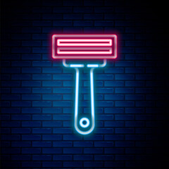 Glowing neon line Shaving razor icon isolated on brick wall background. Colorful outline concept. Vector