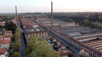 Europe, Italy, Crespi d'Adda closed to Bergamo and Milan is the best preserved workers' village , Founded in 1877 by Cristoforo Crespi - drone aerial view of  textile industry - Unesco Heritage world 