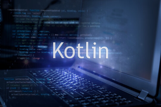 Kotlin inscription against laptop and code background. Technology concept. Learn programming language.