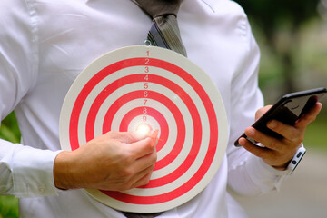 Dart board with target and business growth concept business plan successful