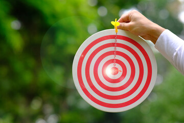 Dart board with target and business growth concept business plan successful