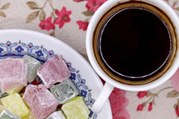 a cup of Turkish coffee and Turkish delight on table
