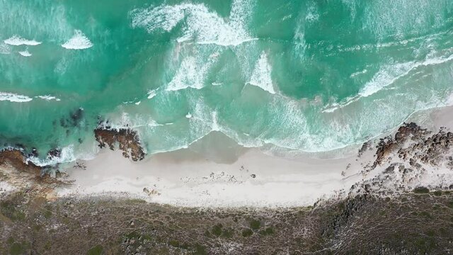 Scenic overhead view of calm sea waves at the beach. Cape of Good Hope, South Africa
