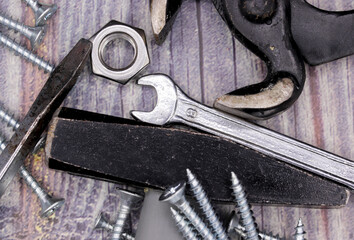 old rusty repair tools on wooden background