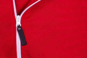 red textured sports jacket fabric with vertical white zipper